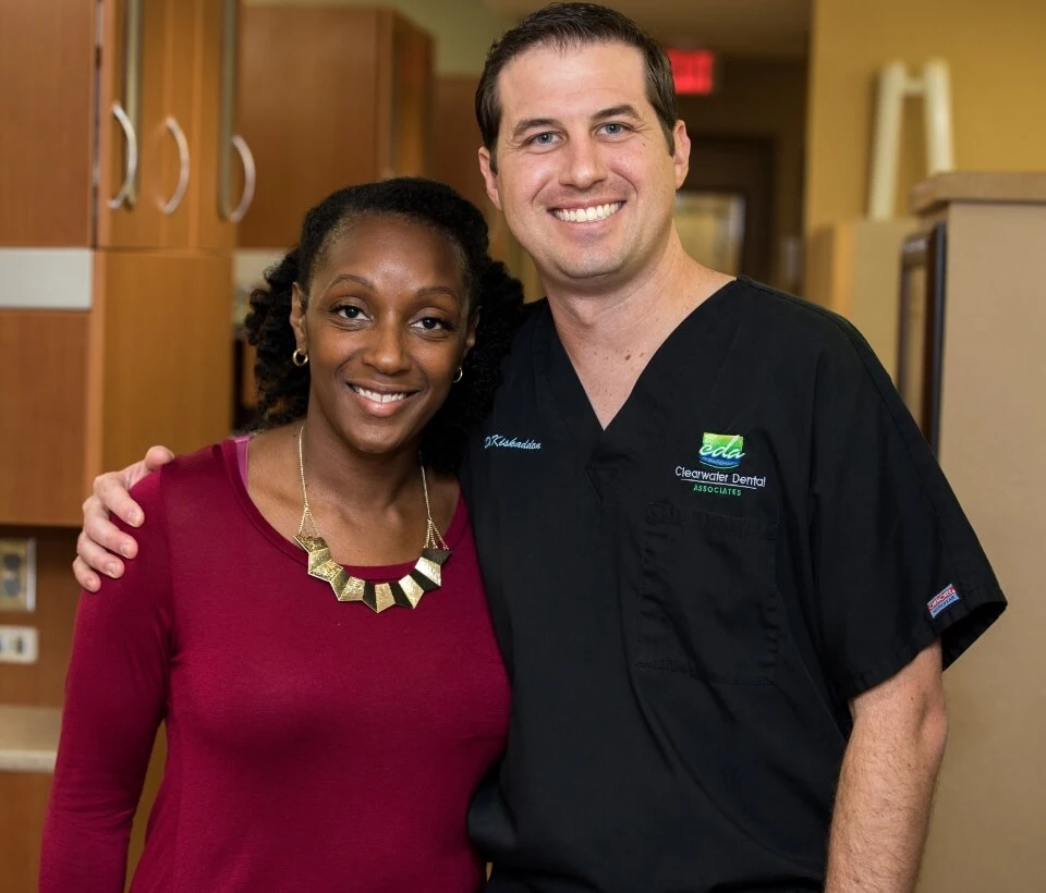 Clearwater dentist Dr. Keith M. Kiskaddon with a patient after her dental appointment