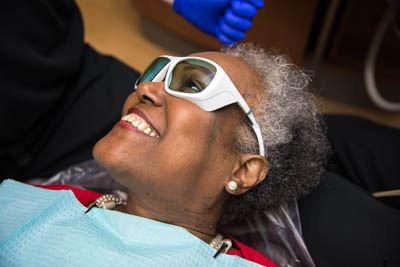 patient smiling during her teeth whitening appointment