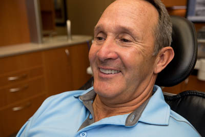 patient smiling after getting dentures at Clearwater Dental Associates