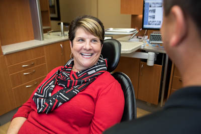 woman smiling during her dental appointment at Clearwater Dental Associates